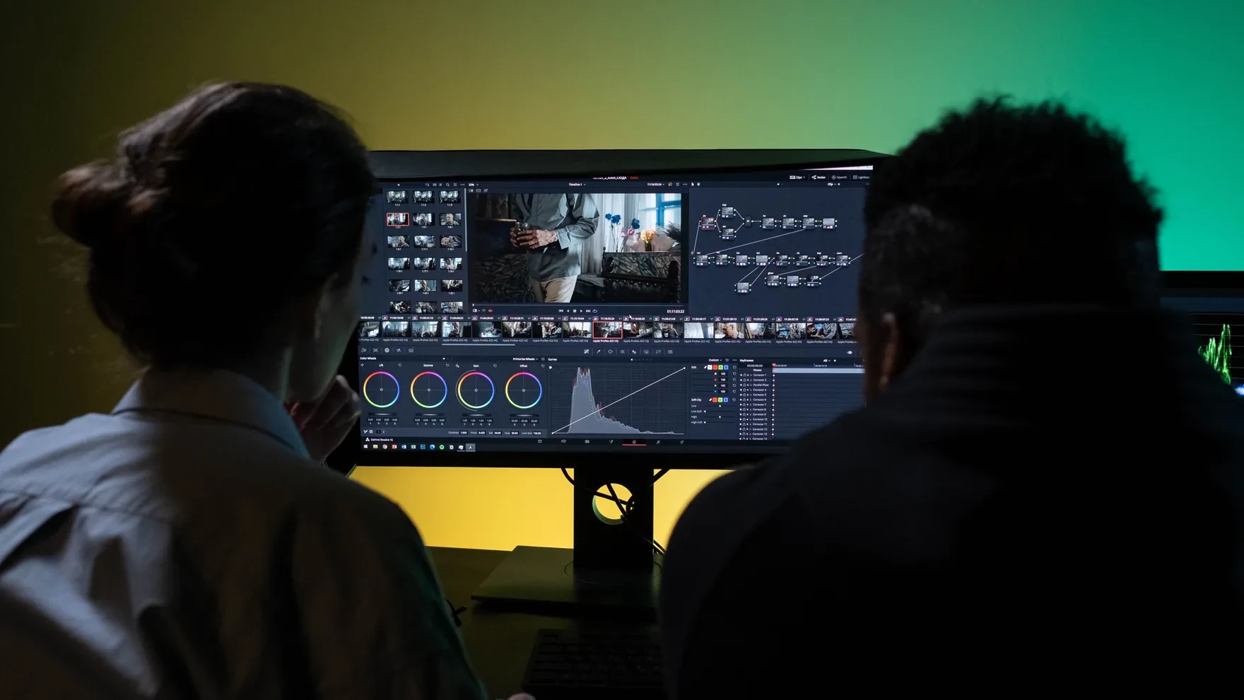 A team of operators in a dark command center coordinating across glowing analytics screens